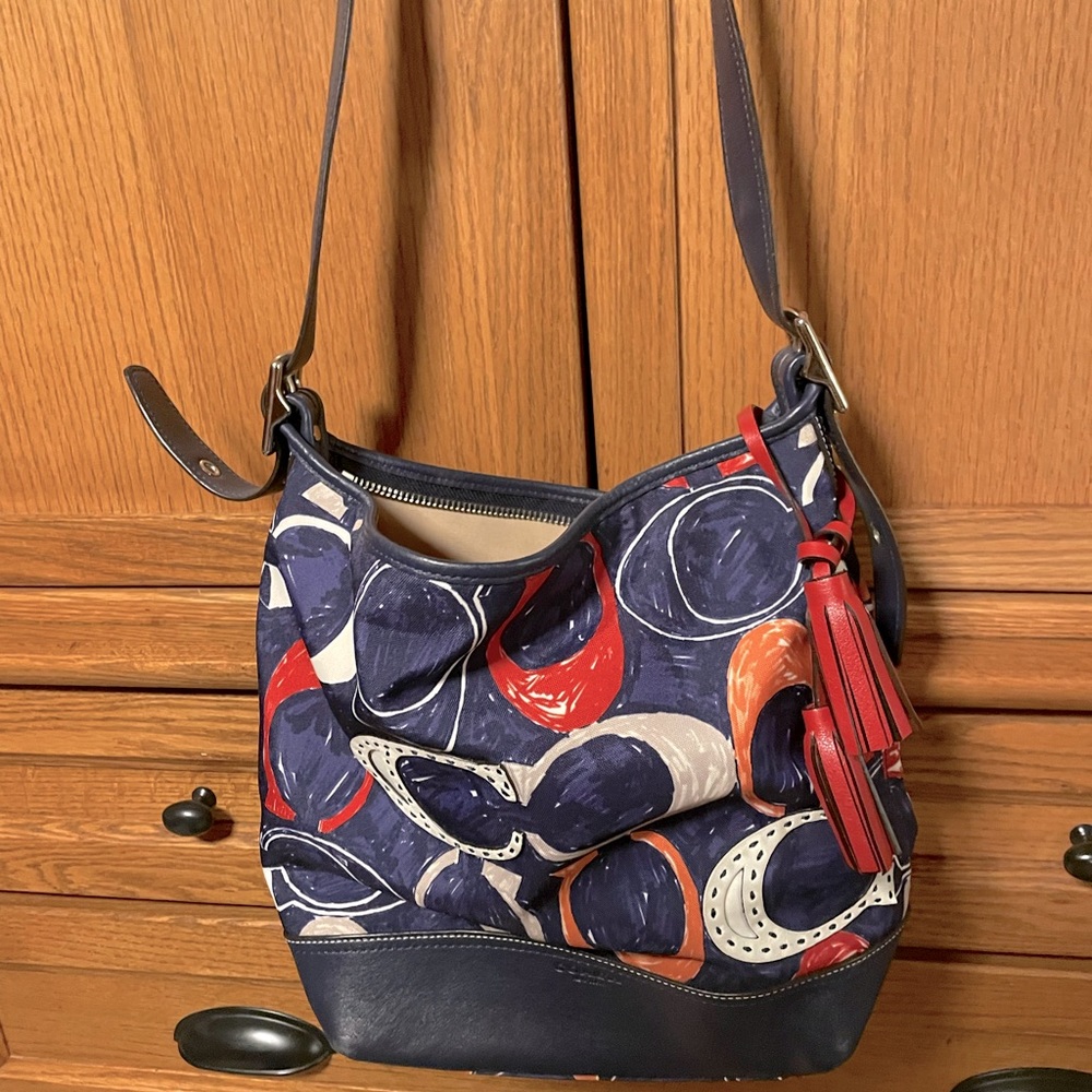 Coach large red, white, and blue purse.